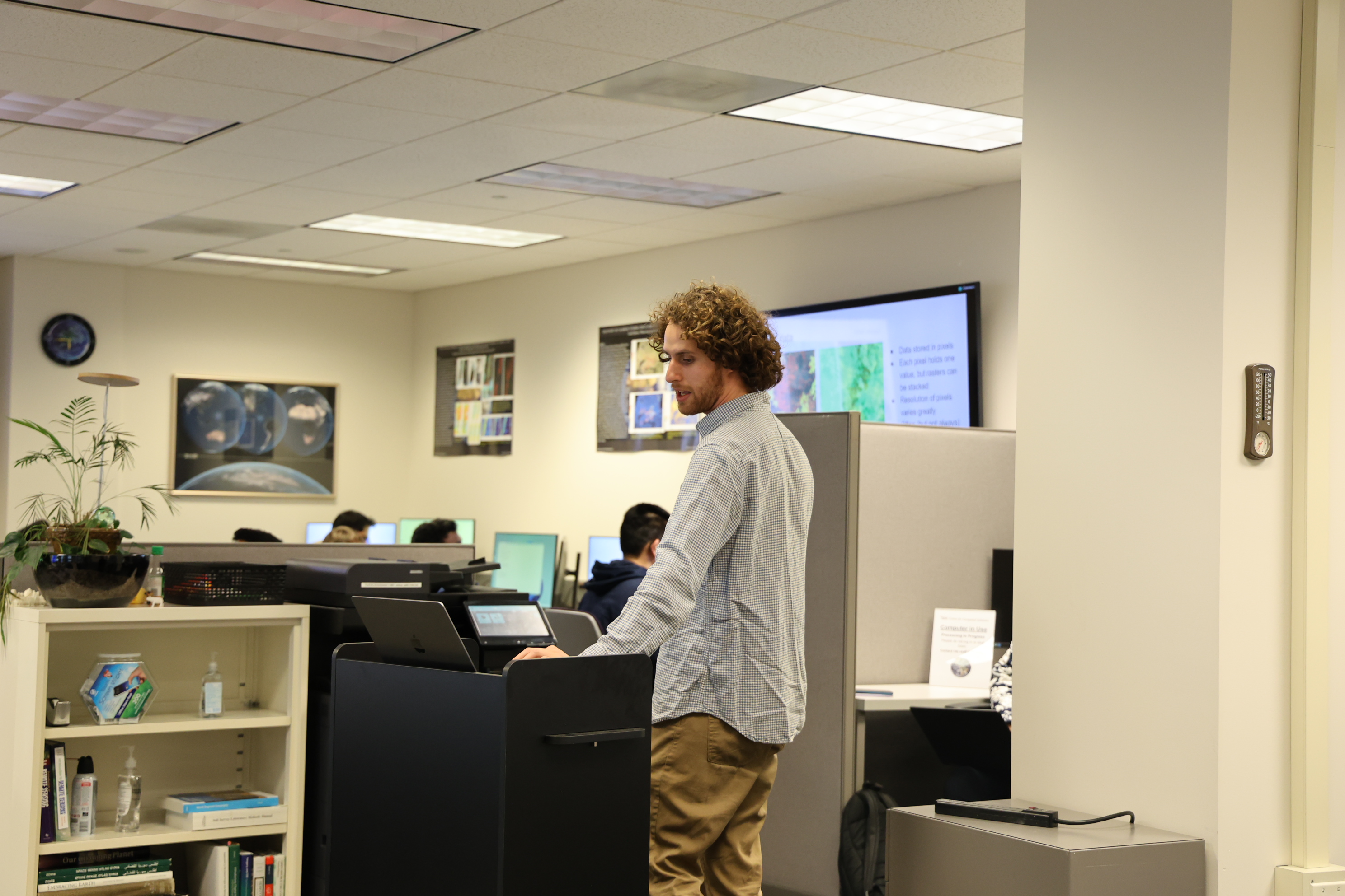 Davi teaching students about GIS