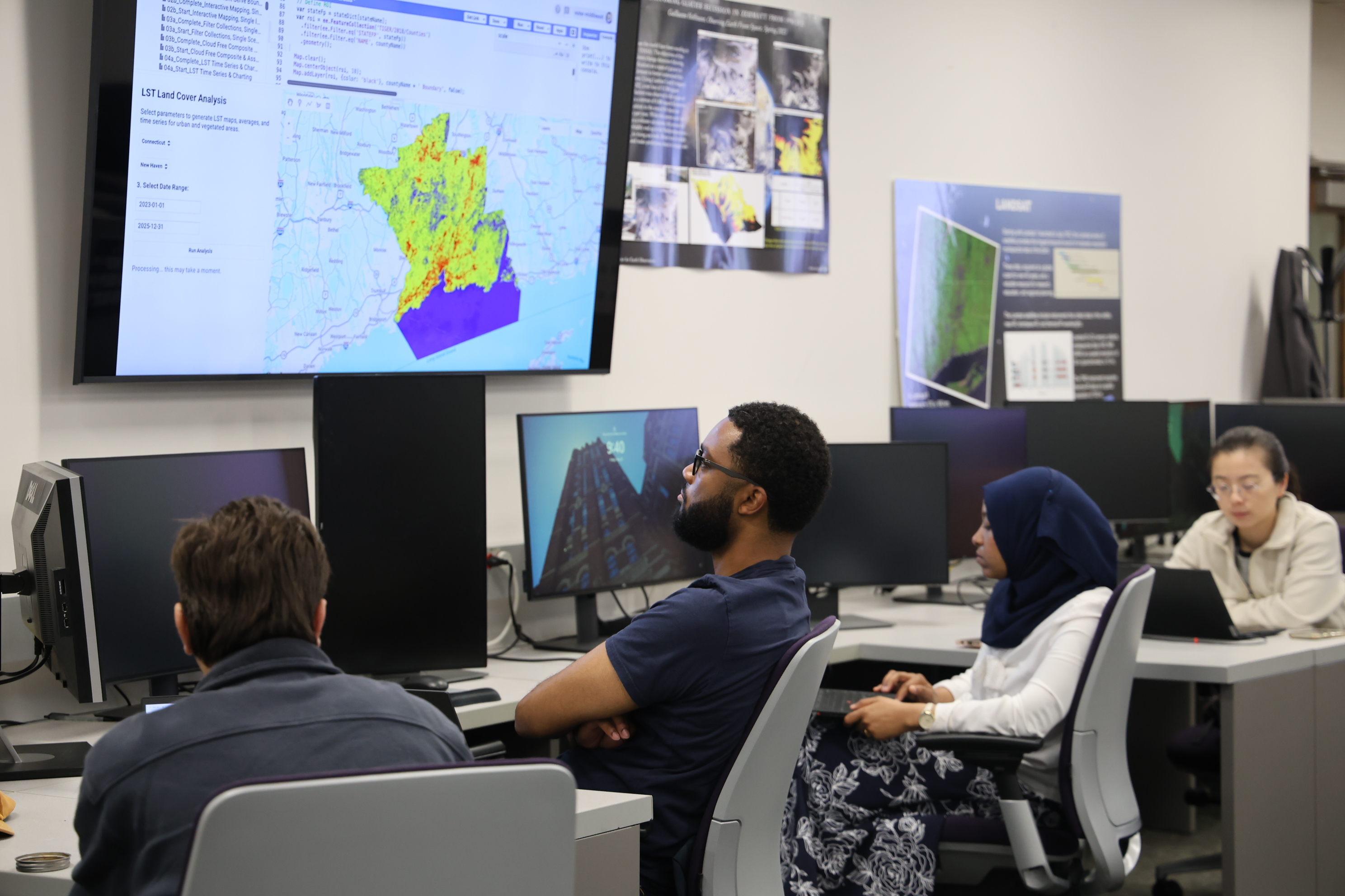 Students looking at GIS plot