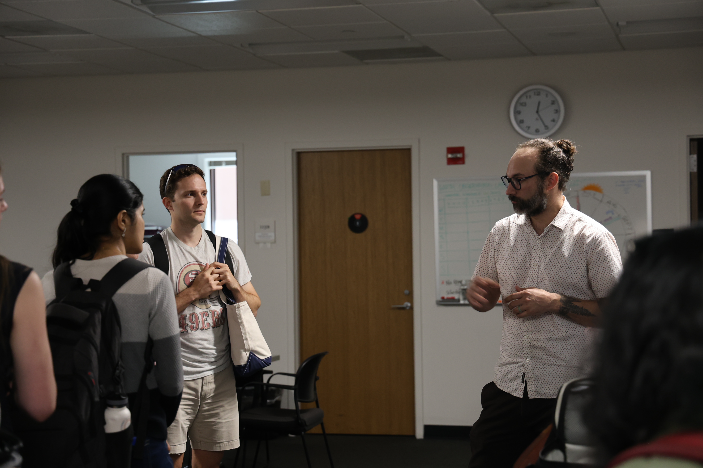 Andrew and students discussing