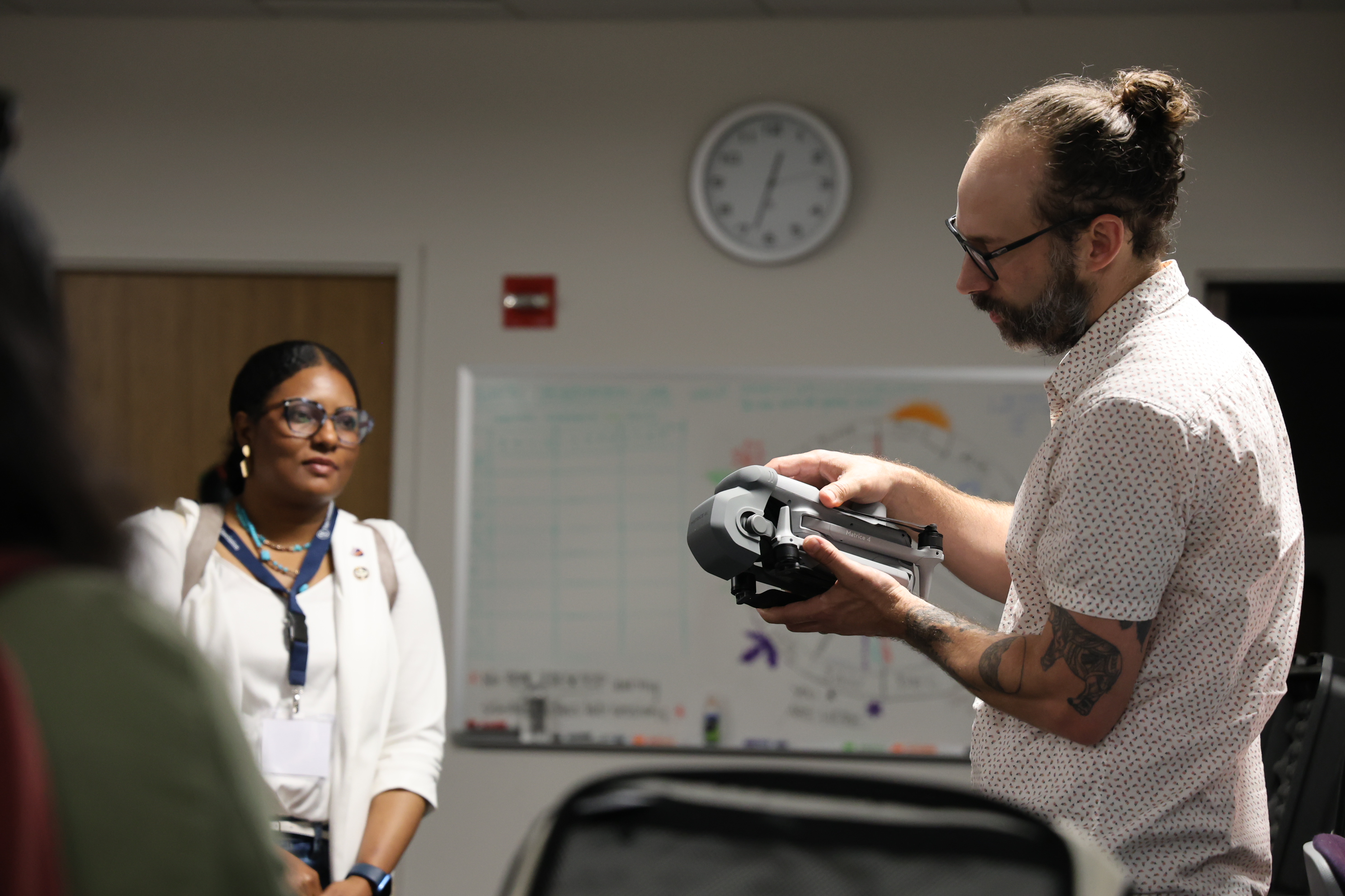 Andrew explaining a device