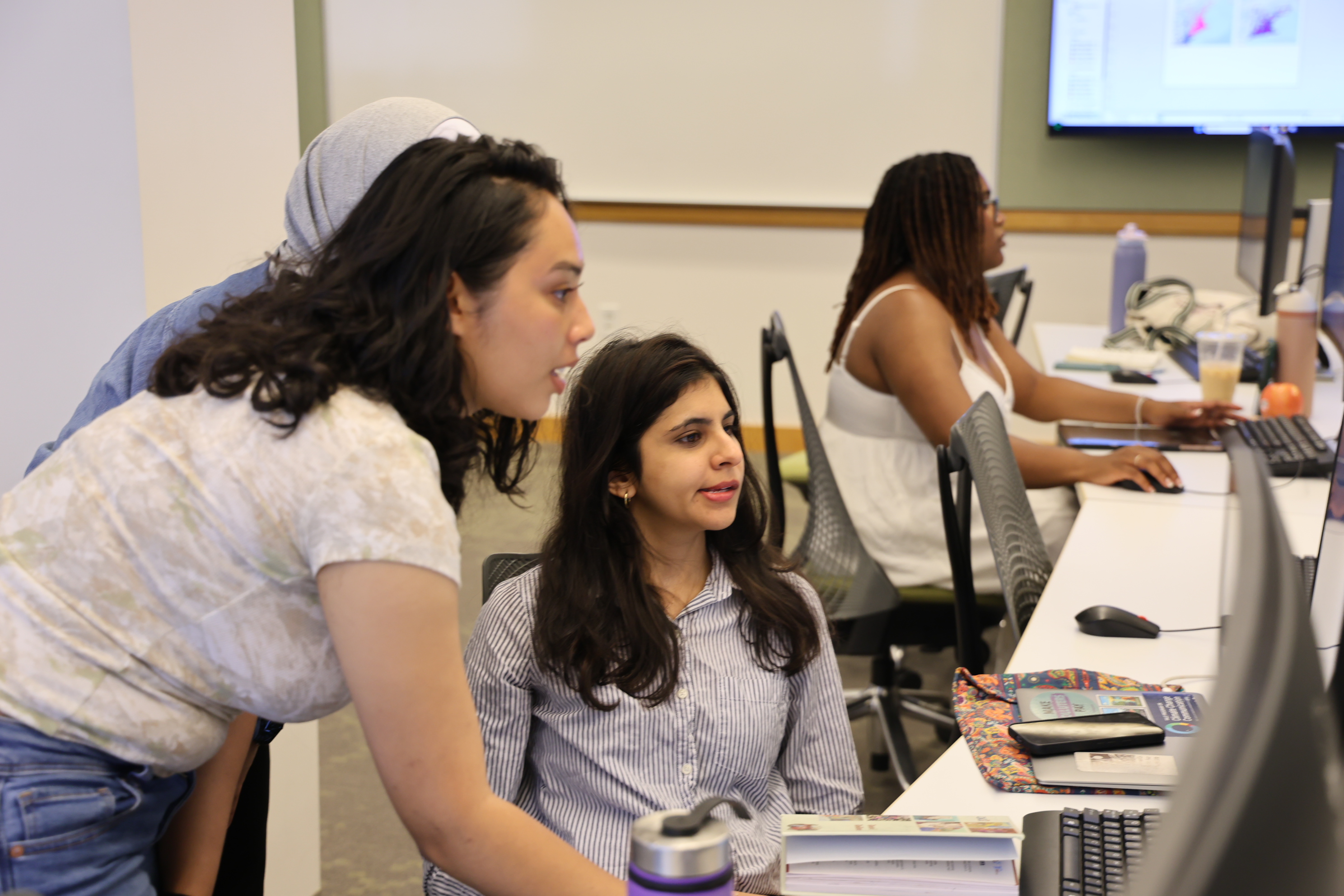 Students and instructors on the computer