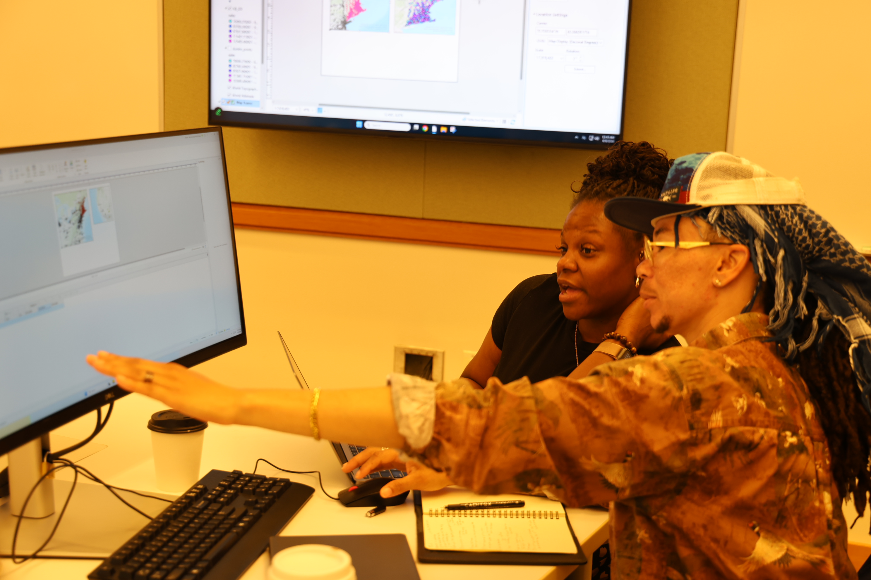 Students and teacher discussing GIS