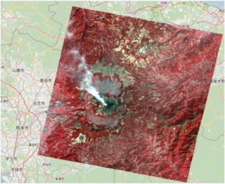 False color overlayed on simple 2-d map, displays a bright white plume emanating from the central crater.